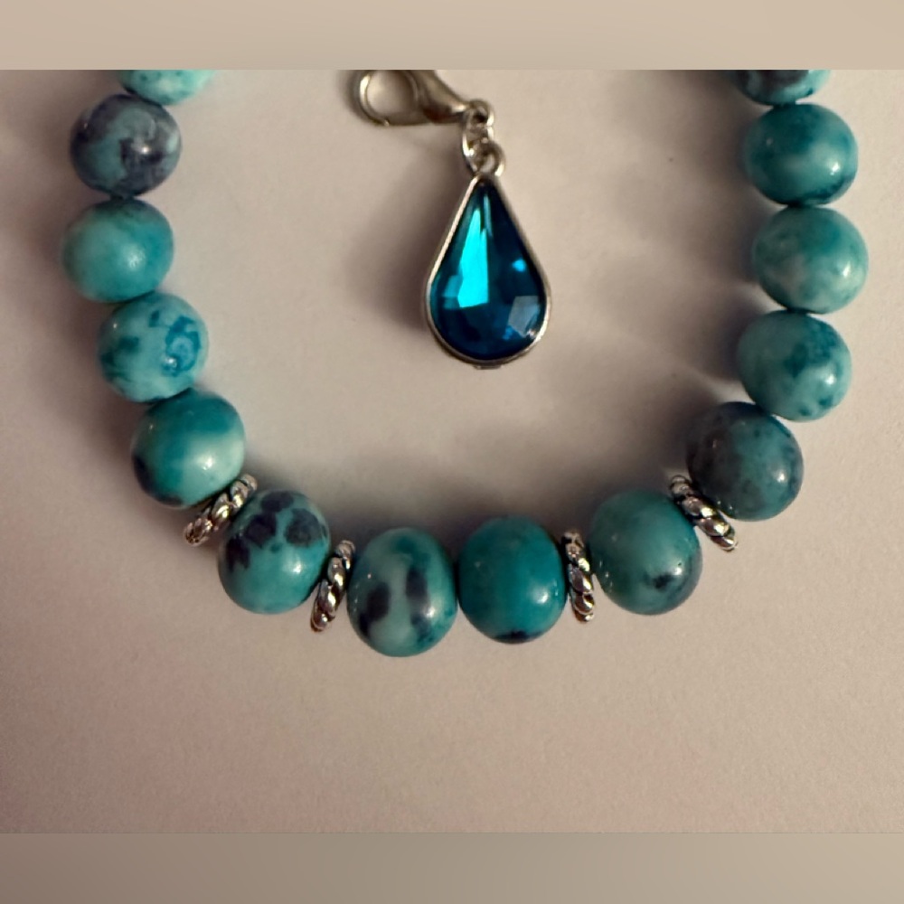 Blue Mulan Gemstone with Crystal Charm.  From our new 2025 designer collection!